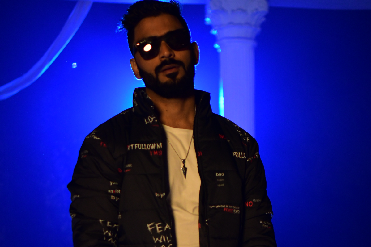 Jishant Malik in blue stage lighting